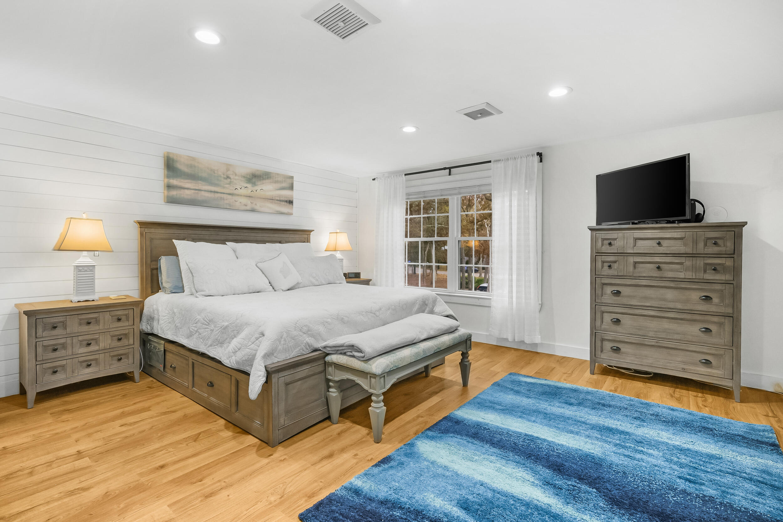 195 Falmouth Road, Unit 7B Mashpee, MA 02649 - Photo 25 of 38 a spacious bedroom with a bed and wooden floor