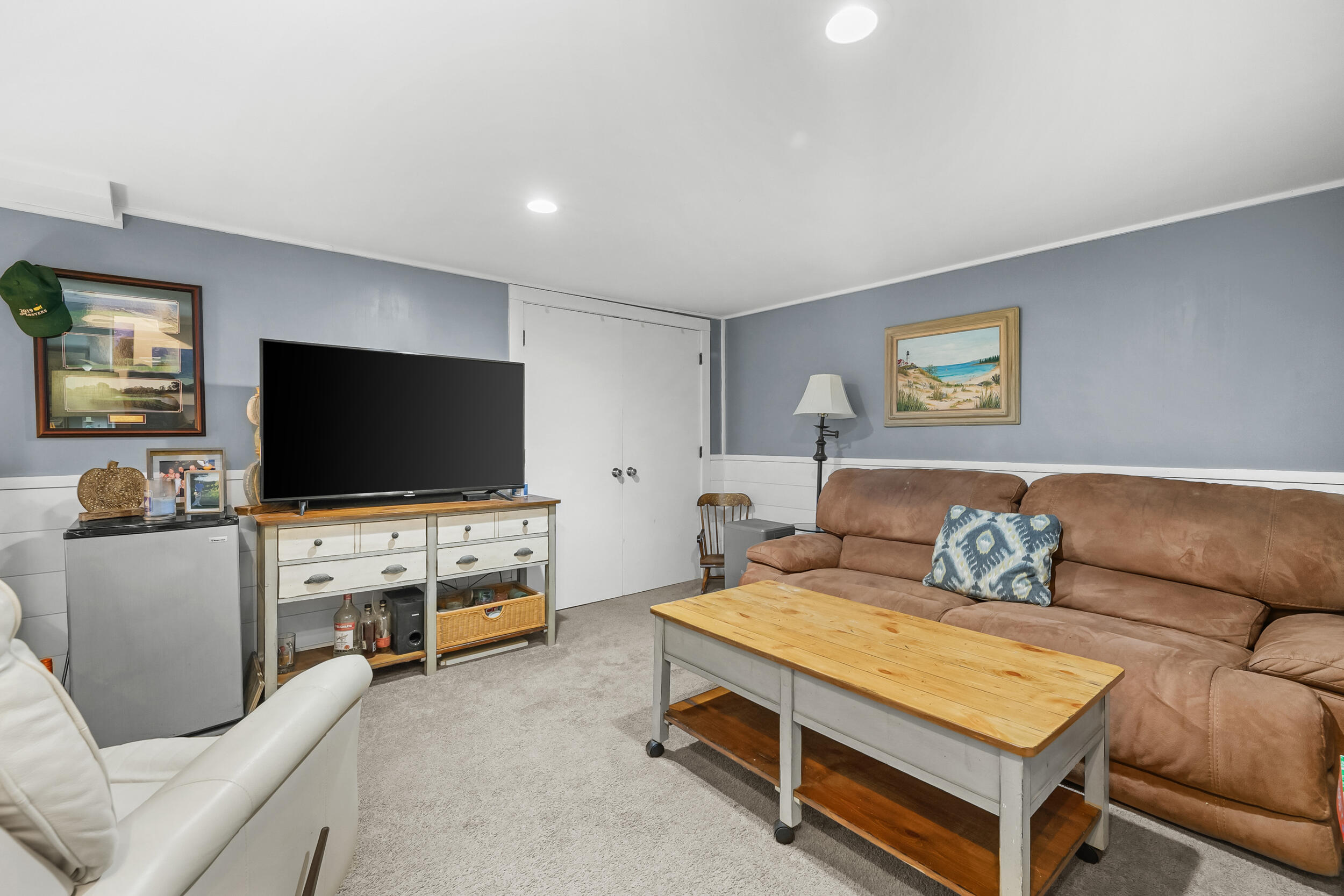 195 Falmouth Road, Unit 7B Mashpee, MA 02649 - Photo 30 of 38 a bedroom with furniture and a flat screen tv