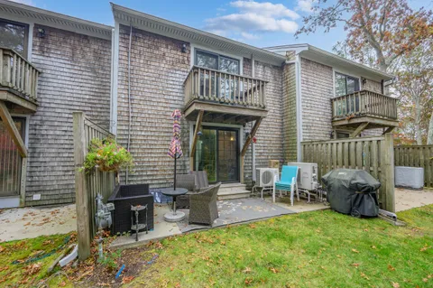 a backyard of a house with seating space