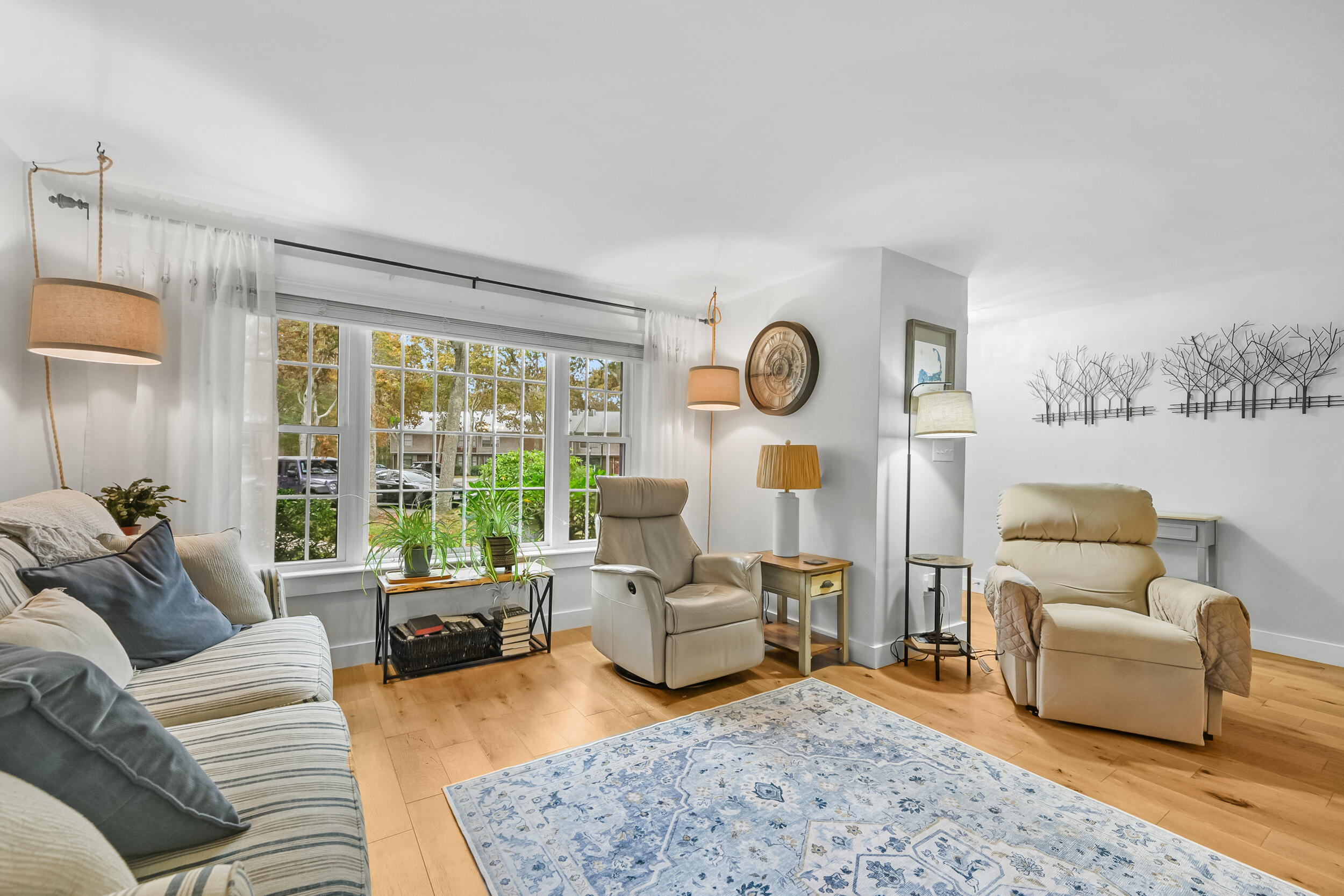 195 Falmouth Road, Unit 7B Mashpee, MA 02649 - Photo 5 of 38 a living room with furniture and a large window