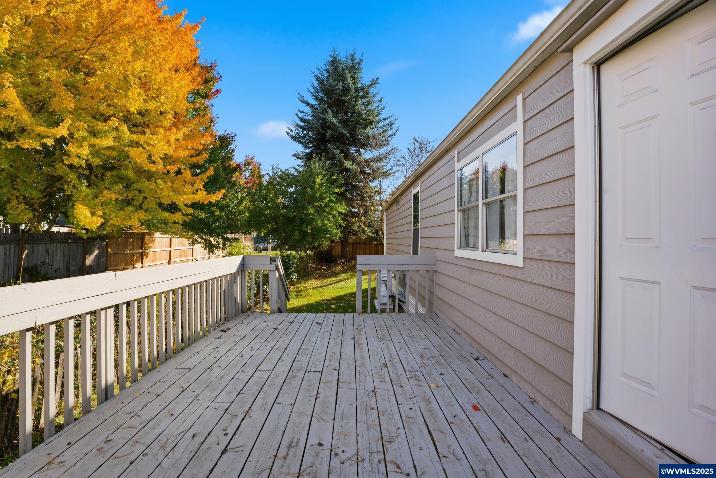 277 Edwards Road, Unit 145 Monmouth, OR 97361 - Photo 28 of 47 a view of house with deck and wooden floor