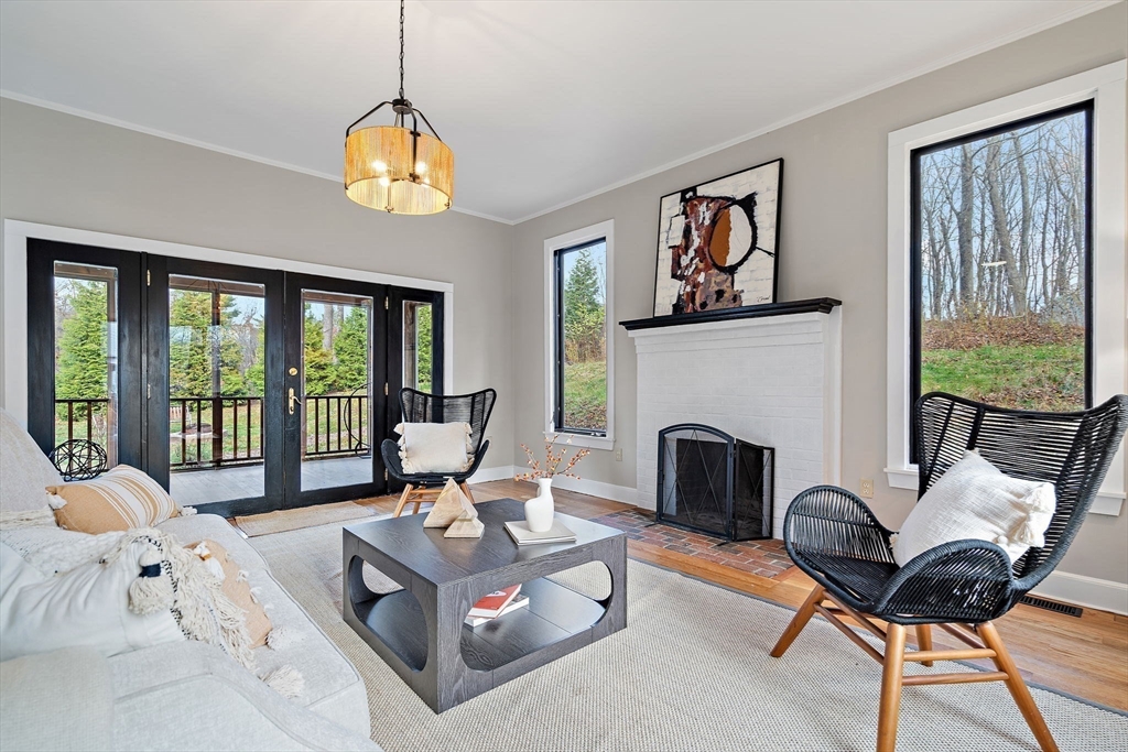 169 Main Street Acton, MA 01720 - Photo 14 of 39 a living room with furniture fireplace and a large window
