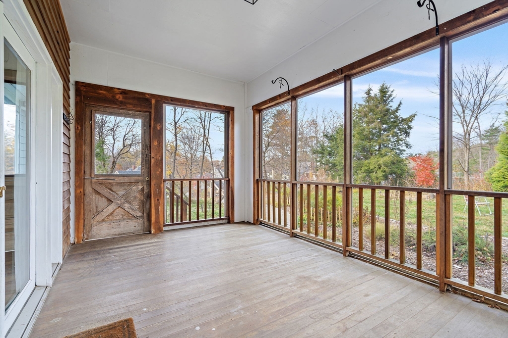 169 Main Street Acton, MA 01720 - Photo 17 of 39 a view of a room with wooden floor and large windows