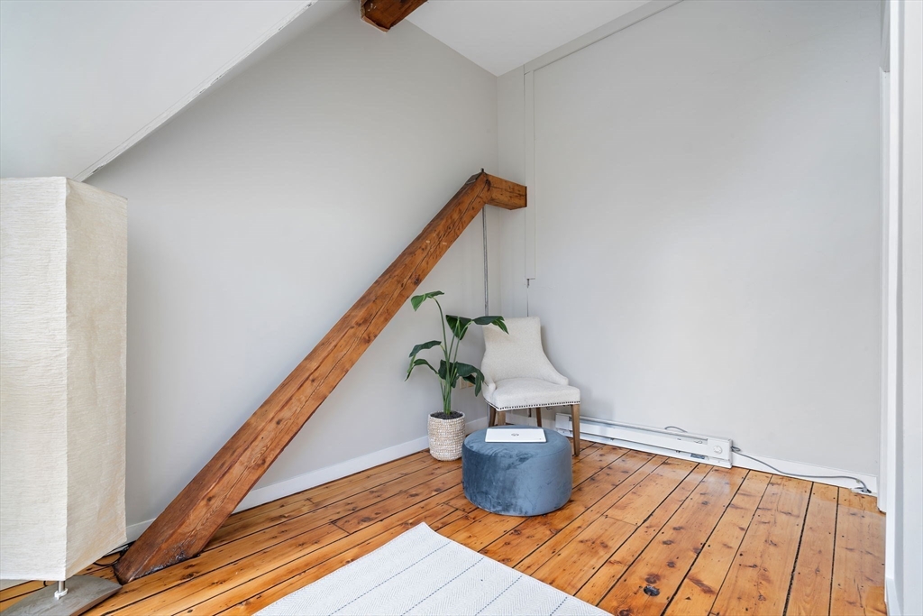 169 Main Street Acton, MA 01720 - Photo 24 of 39 a dining room with wooden floor and stairs