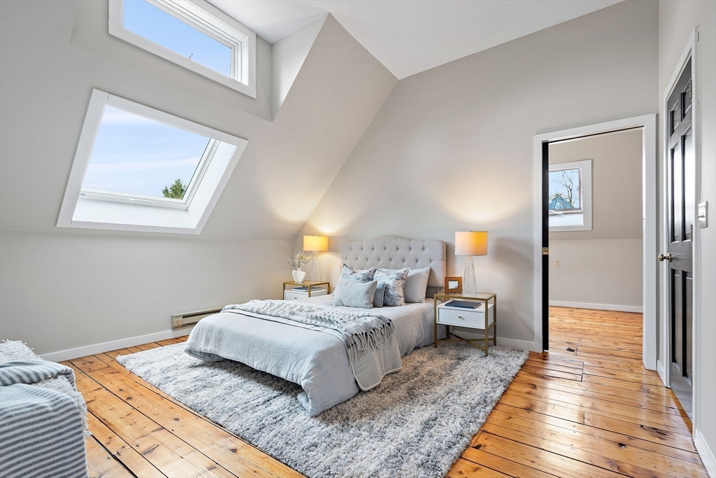169 Main Street Acton, MA 01720 - Photo 26 of 39 a bedroom with a bed and wooden floor