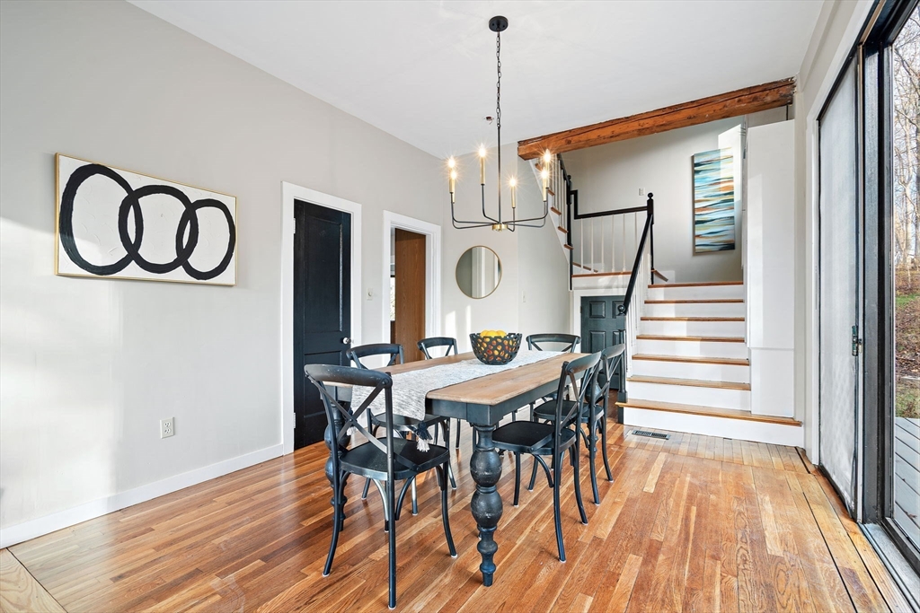 169 Main Street Acton, MA 01720 - Photo 6 of 39 a view of a dining room with furniture wooden floor and chandelier