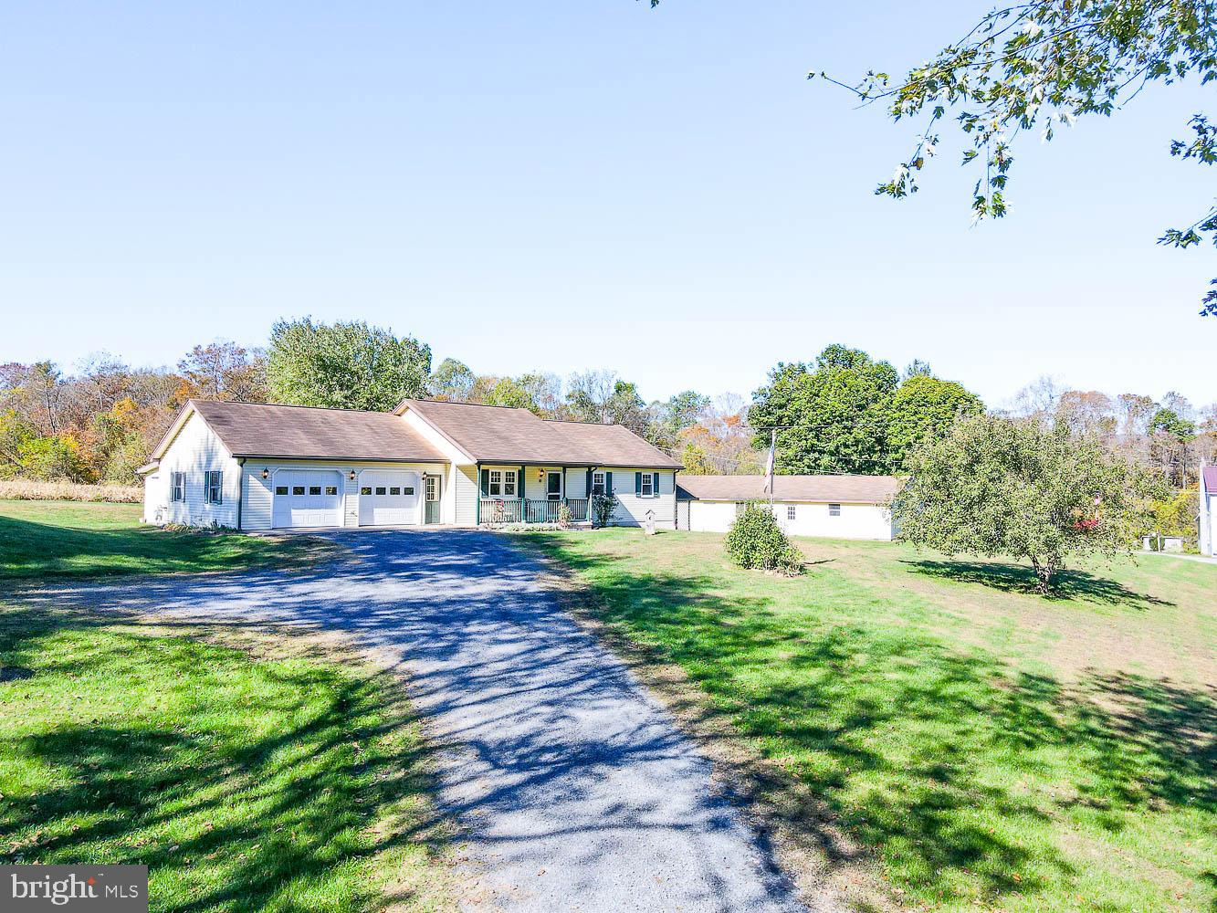10 Flat Land Road Lewistown, PA 17044 - Photo 1 of 64 a view of a big house with a big yard and large tree