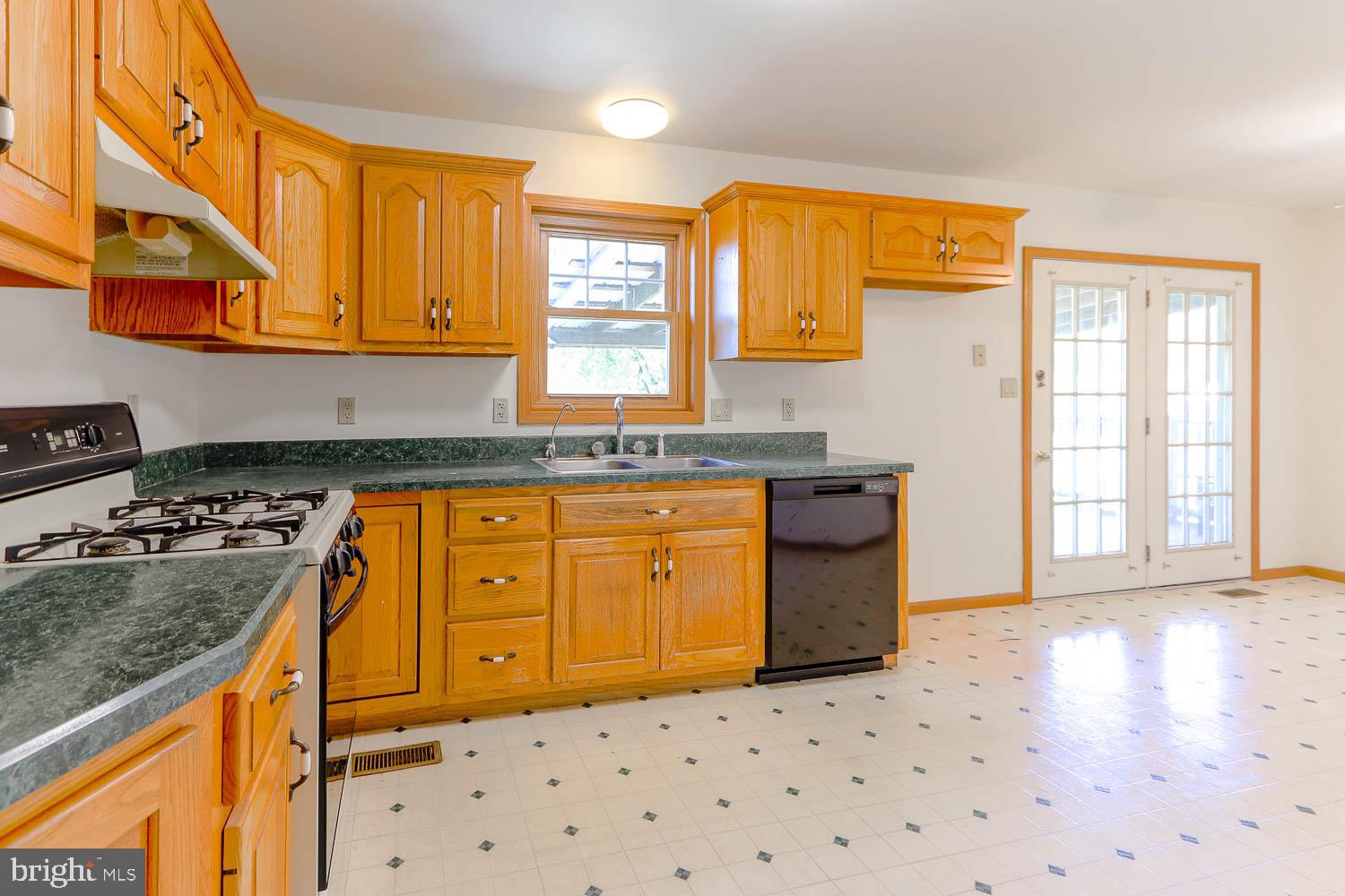10 Flat Land Road Lewistown, PA 17044 - Photo 14 of 64 a kitchen with granite countertop a sink a stove a counter space and cabinets