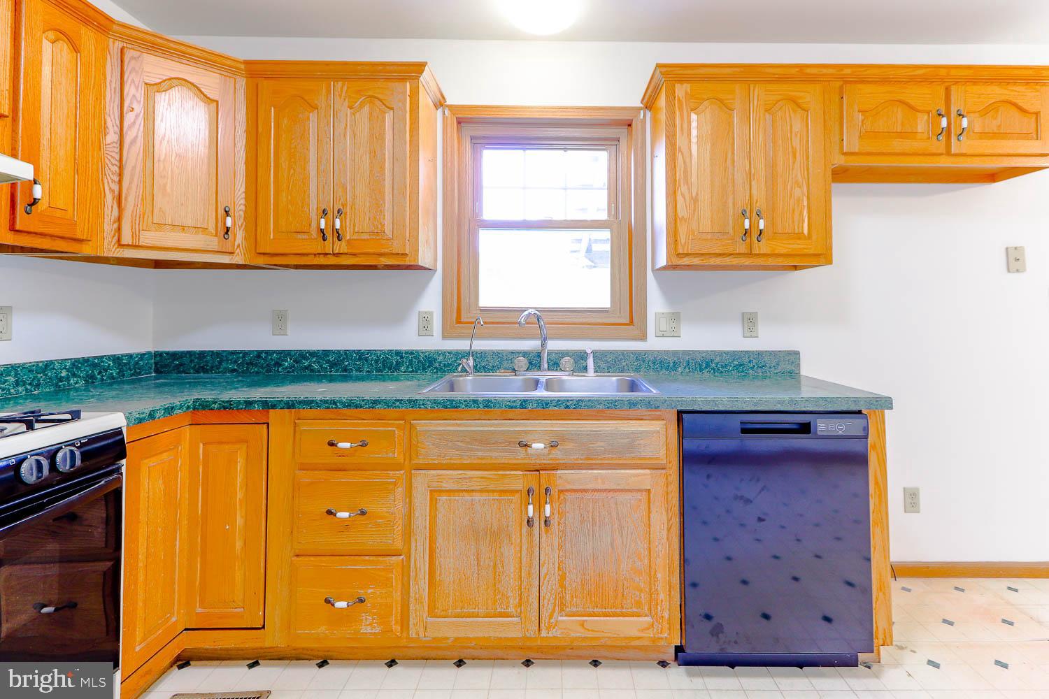 10 Flat Land Road Lewistown, PA 17044 - Photo 15 of 64 a kitchen with granite countertop wooden cabinets and a sink