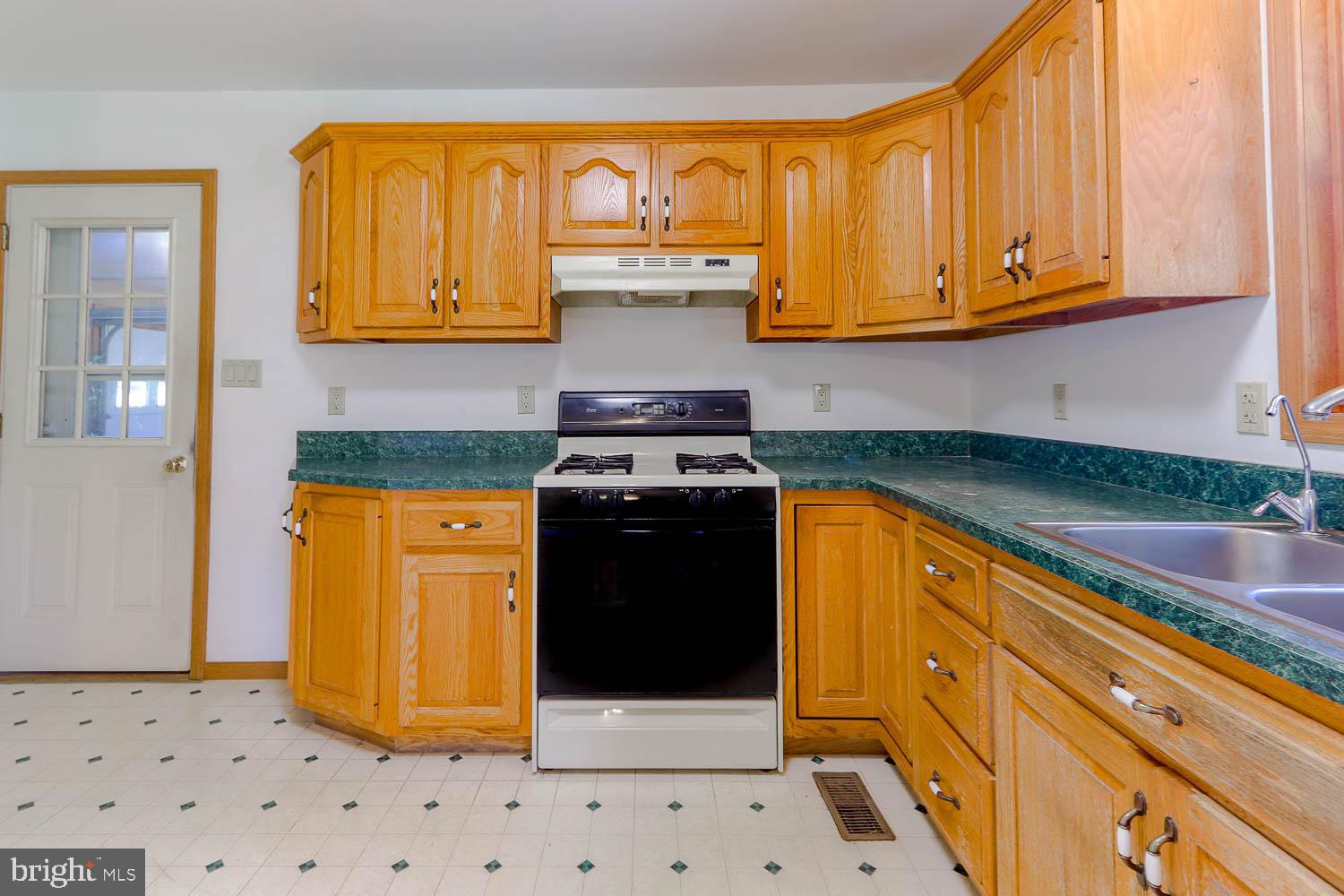 10 Flat Land Road Lewistown, PA 17044 - Photo 16 of 64 a kitchen with stainless steel appliances granite countertop a stove a sink and a microwave