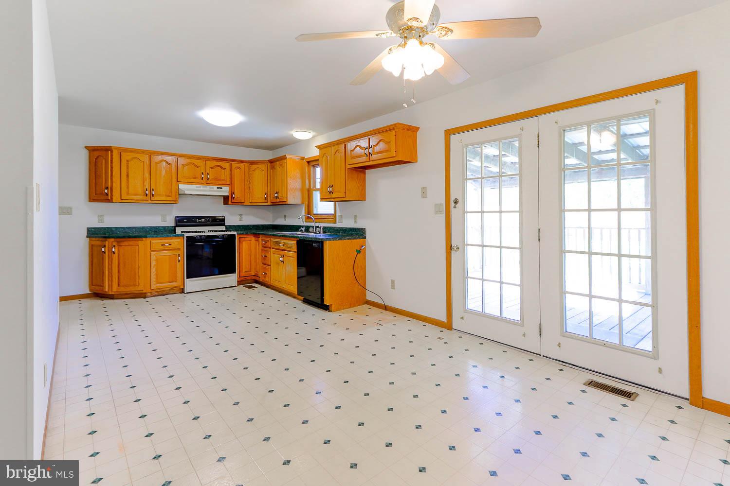 10 Flat Land Road Lewistown, PA 17044 - Photo 19 of 64 a kitchen with stainless steel appliances kitchen island granite countertop a refrigerator and a sink