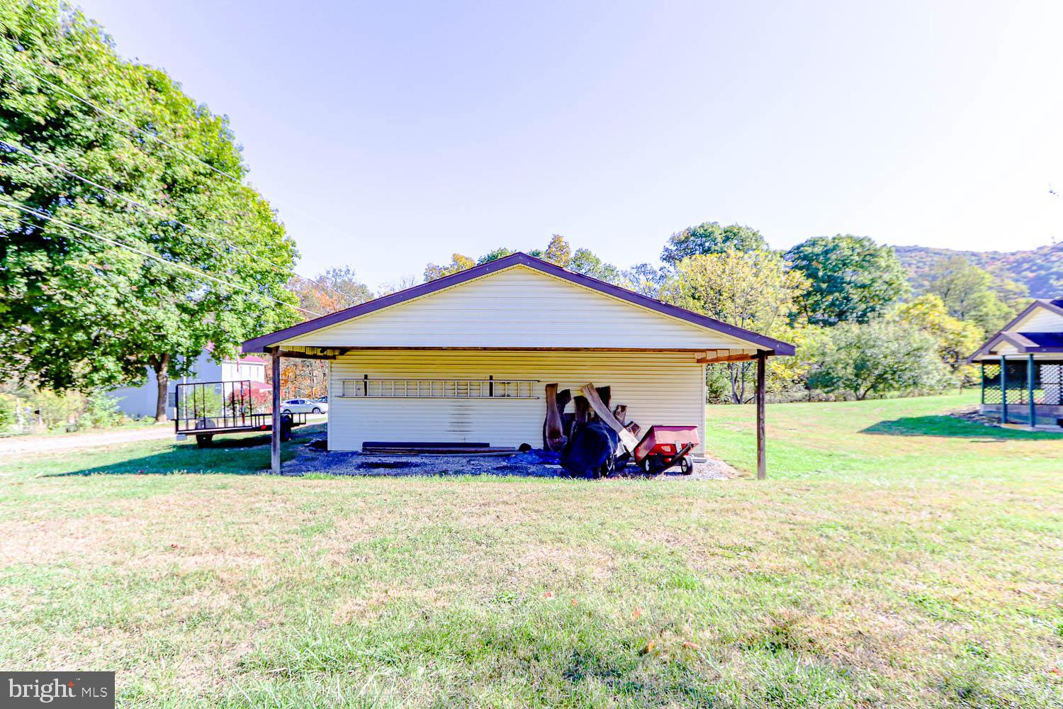 10 Flat Land Road Lewistown, PA 17044 - Photo 51 of 64 a view of patio with a table and chairs under an umbrella