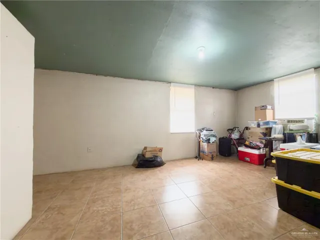 a bedroom with a bed and cabinets