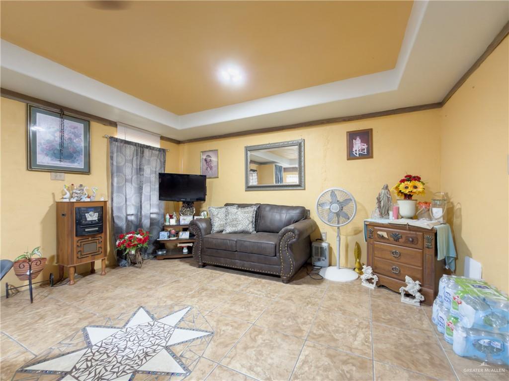 21707 Hidalgo Street Edcouch, TX 78538 - Photo 19 of 27 a living room with furniture and a fireplace
