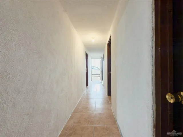 a view of a wooden door of the house