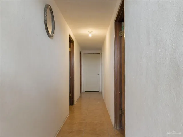 a bed room with a bed and a television