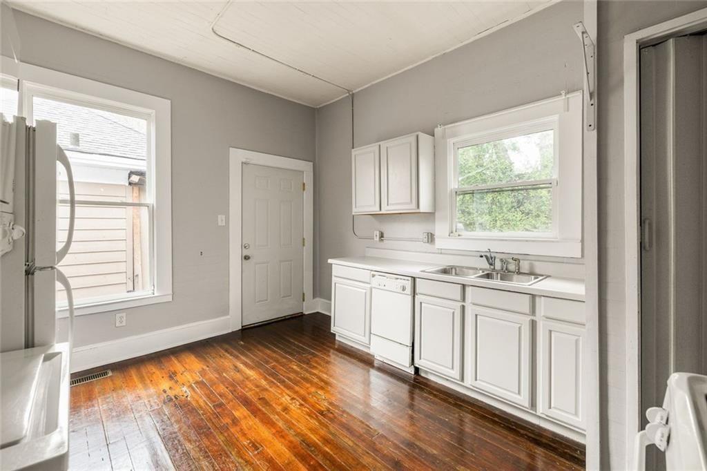 796 Fulton Terrace Southeast Atlanta, GA 30316 - Photo 11 of 35 a view of a kitchen with wooden floor and electronic appliances