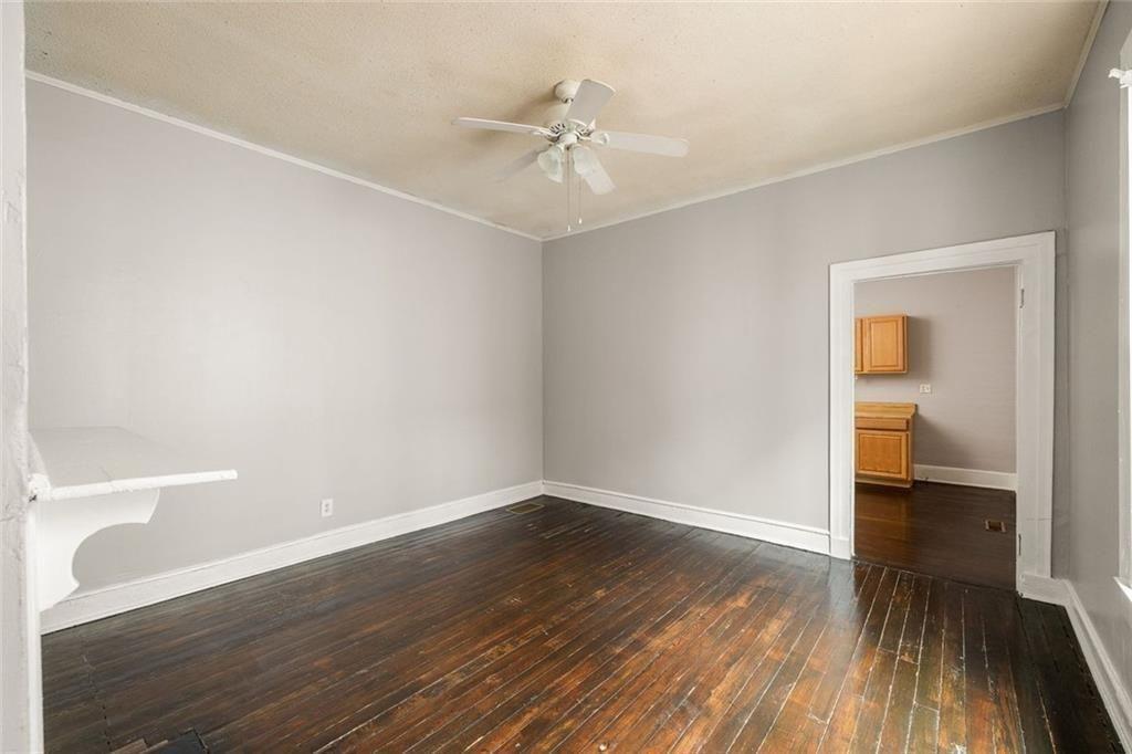 796 Fulton Terrace Southeast Atlanta, GA 30316 - Photo 17 of 35 wooden floor in an empty room with a window