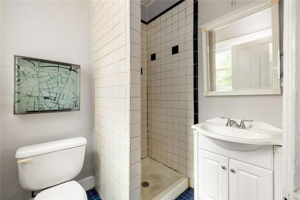 796 Fulton Terrace Southeast Atlanta, GA 30316 - Photo 22 of 35 a bathroom with a sink toilet and shower