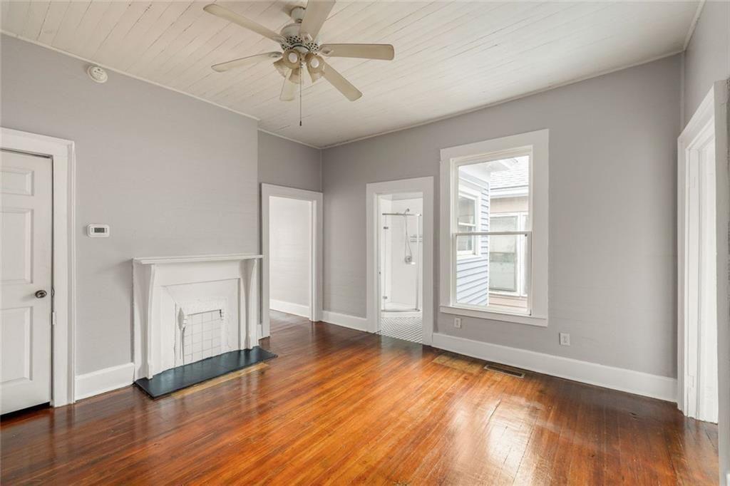 796 Fulton Terrace Southeast Atlanta, GA 30316 - Photo 7 of 35 a view of empty room with wooden floor and fan