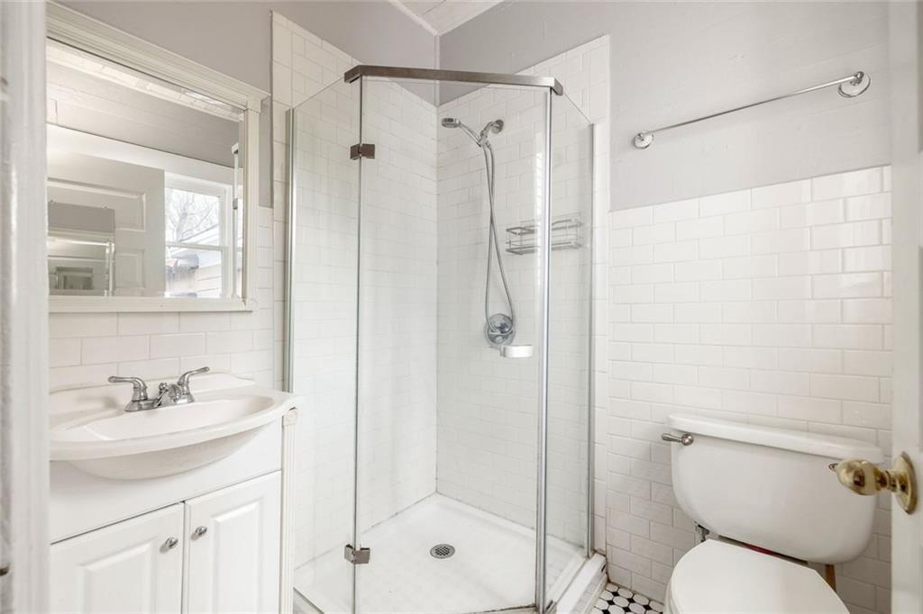 796 Fulton Terrace Southeast Atlanta, GA 30316 - Photo 8 of 35 a bathroom with a shower sink mirror and toilet