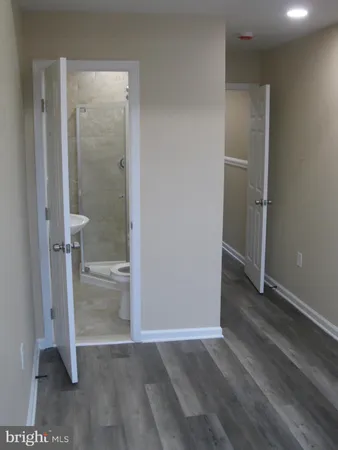 a view of a bathroom with a glass door and shower