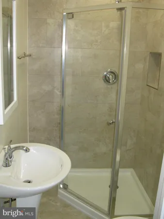 a bathroom with a sink and a shower