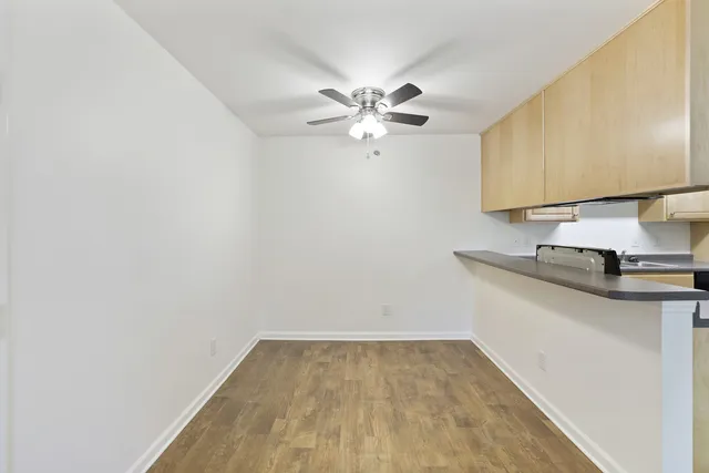 a view of a kitchen with a sink and a microwave