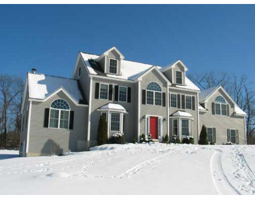 389 Mulpus Road Lunenburg, MA 01462 - Photo 1 of 26 a front view of a house with a yard
