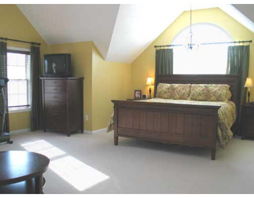 389 Mulpus Road Lunenburg, MA 01462 - Photo 13 of 26 a bedroom with a bed and a mirror