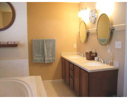 389 Mulpus Road Lunenburg, MA 01462 - Photo 15 of 26 a en suite bathroom with a sink and a mirror