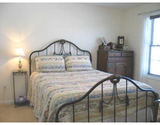 389 Mulpus Road Lunenburg, MA 01462 - Photo 17 of 26 a bedroom with a bed and a window