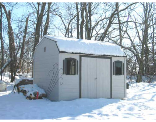 389 Mulpus Road Lunenburg, MA 01462 - Photo 25 of 26 a view of a house with a snow in the yard