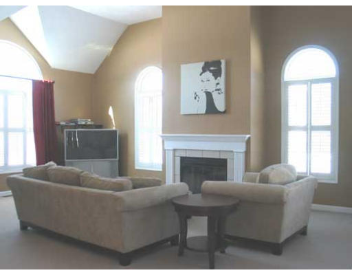389 Mulpus Road Lunenburg, MA 01462 - Photo 6 of 26 a living room with furniture and a fireplace
