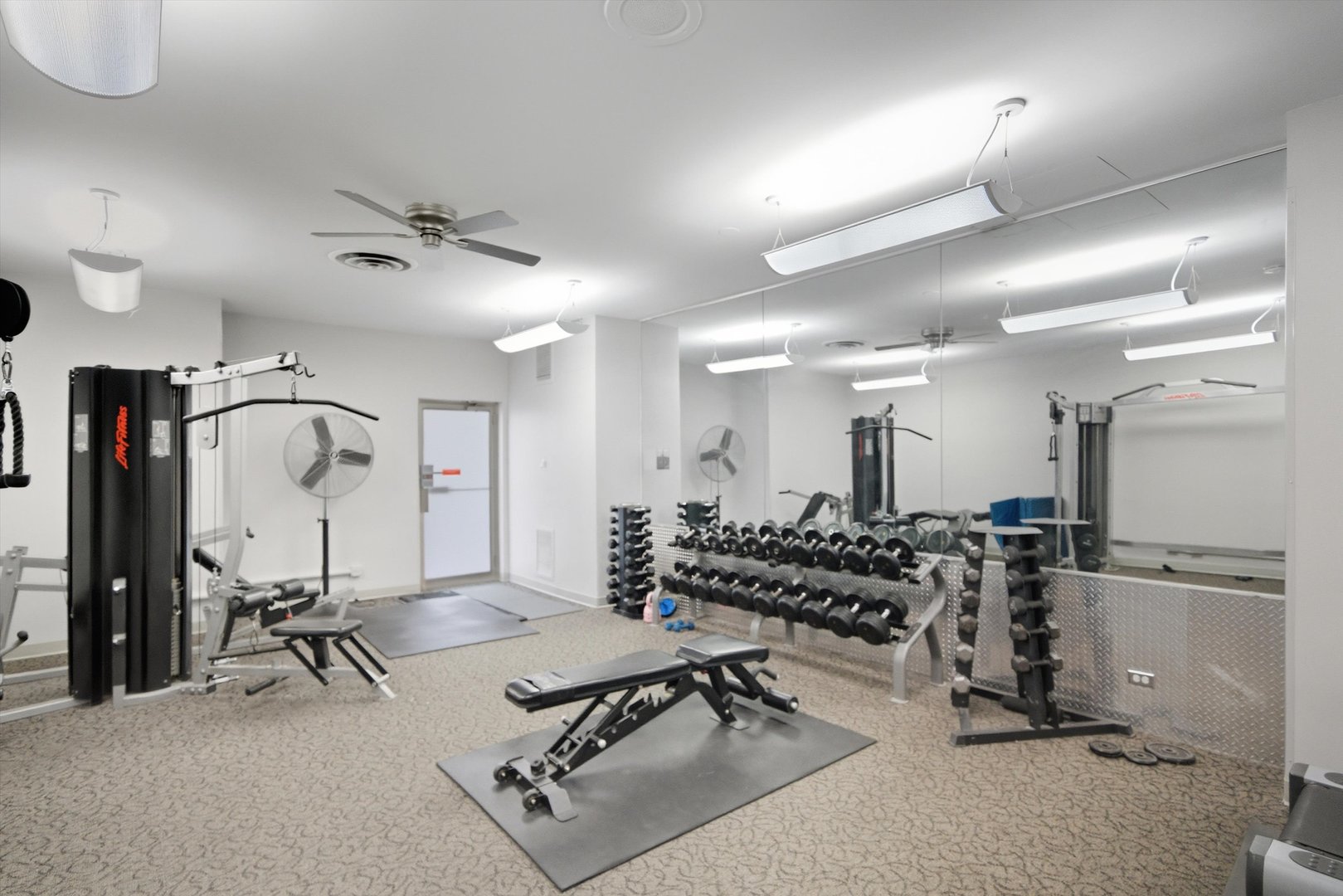 6301 North Sheridan Road, Unit 14G Chicago, IL 60660 - Photo 18 of 22 a view of a room with gym equipment