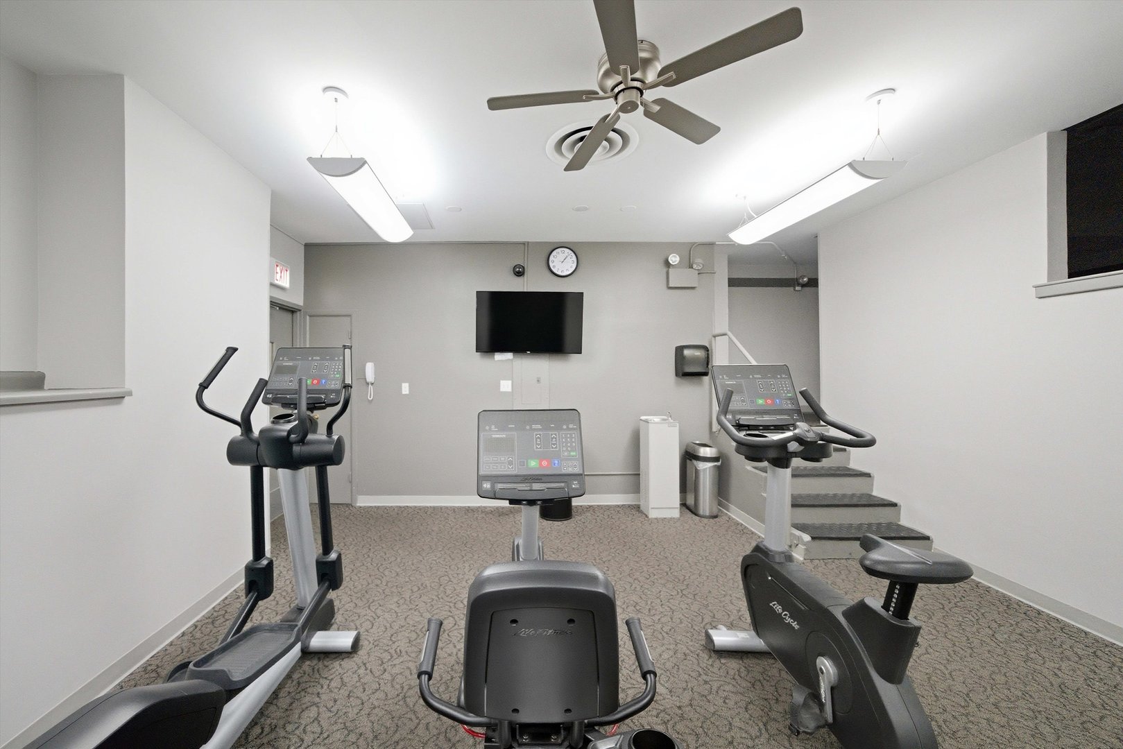 6301 North Sheridan Road, Unit 14G Chicago, IL 60660 - Photo 21 of 22 a room with gym equipment and a flat screen tv