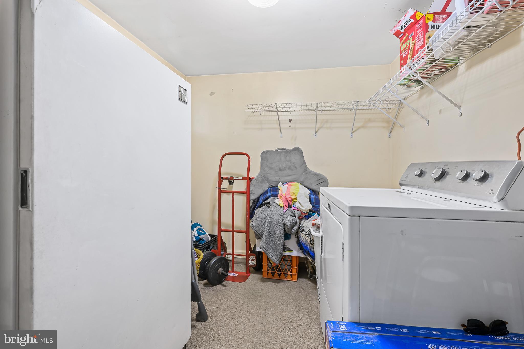 8 Augusta Drive Newark, DE 19713 - Photo 19 of 23 a storage room with washer and dryer
