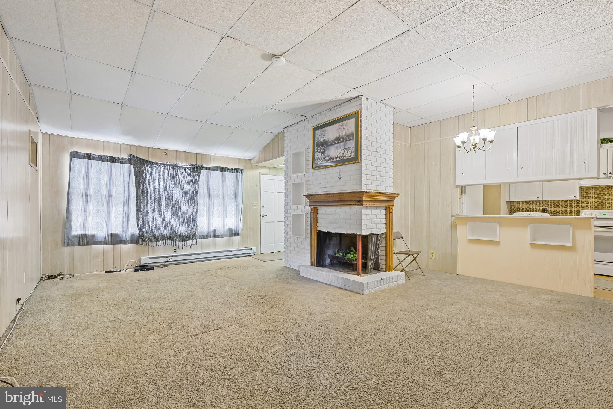 8 Augusta Drive Newark, DE 19713 - Photo 6 of 23 a view of kitchen with furniture and fireplace