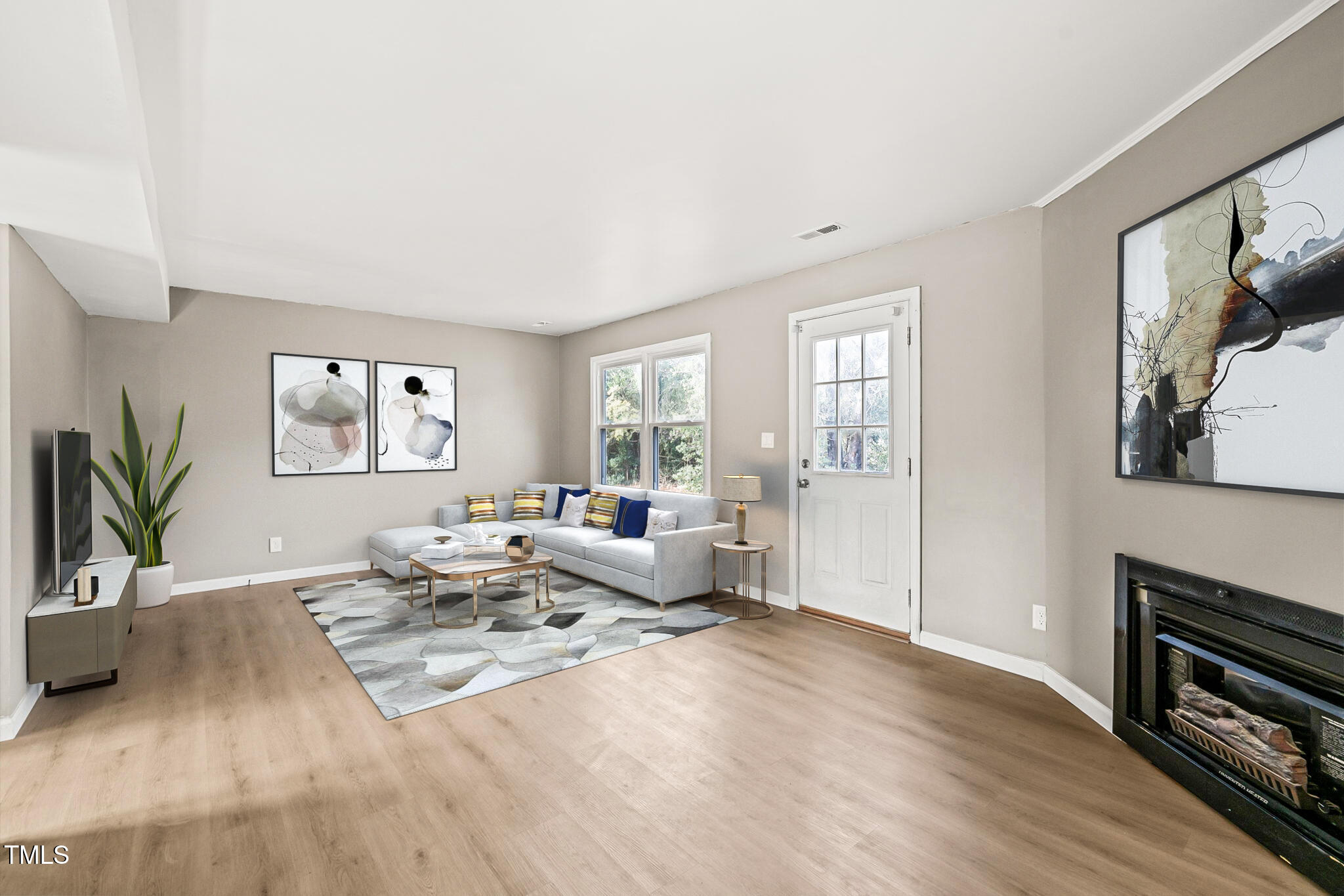 621 Bashford Road Raleigh, NC 27606 - Photo 2 of 29 a living room with furniture large window and wooden floor