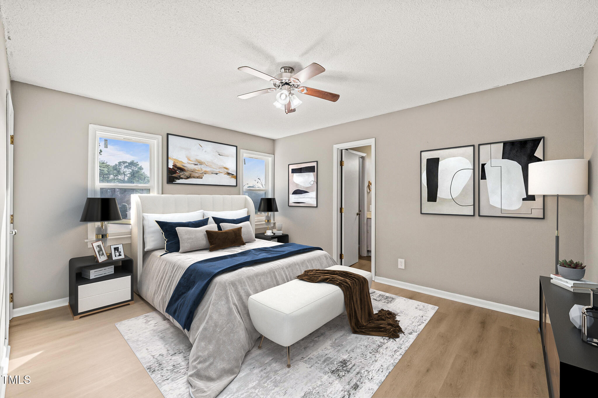 621 Bashford Road Raleigh, NC 27606 - Photo 6 of 29 a bedroom with a bed and a painting on the wall