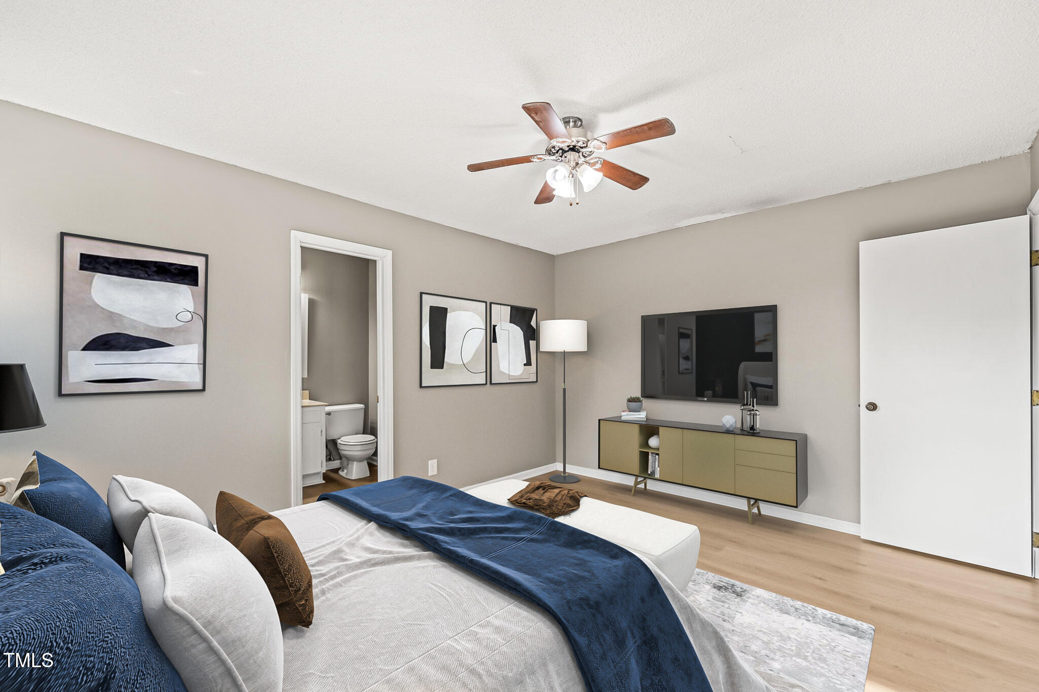 621 Bashford Road Raleigh, NC 27606 - Photo 7 of 29 a bedroom with a bed and a flat screen tv