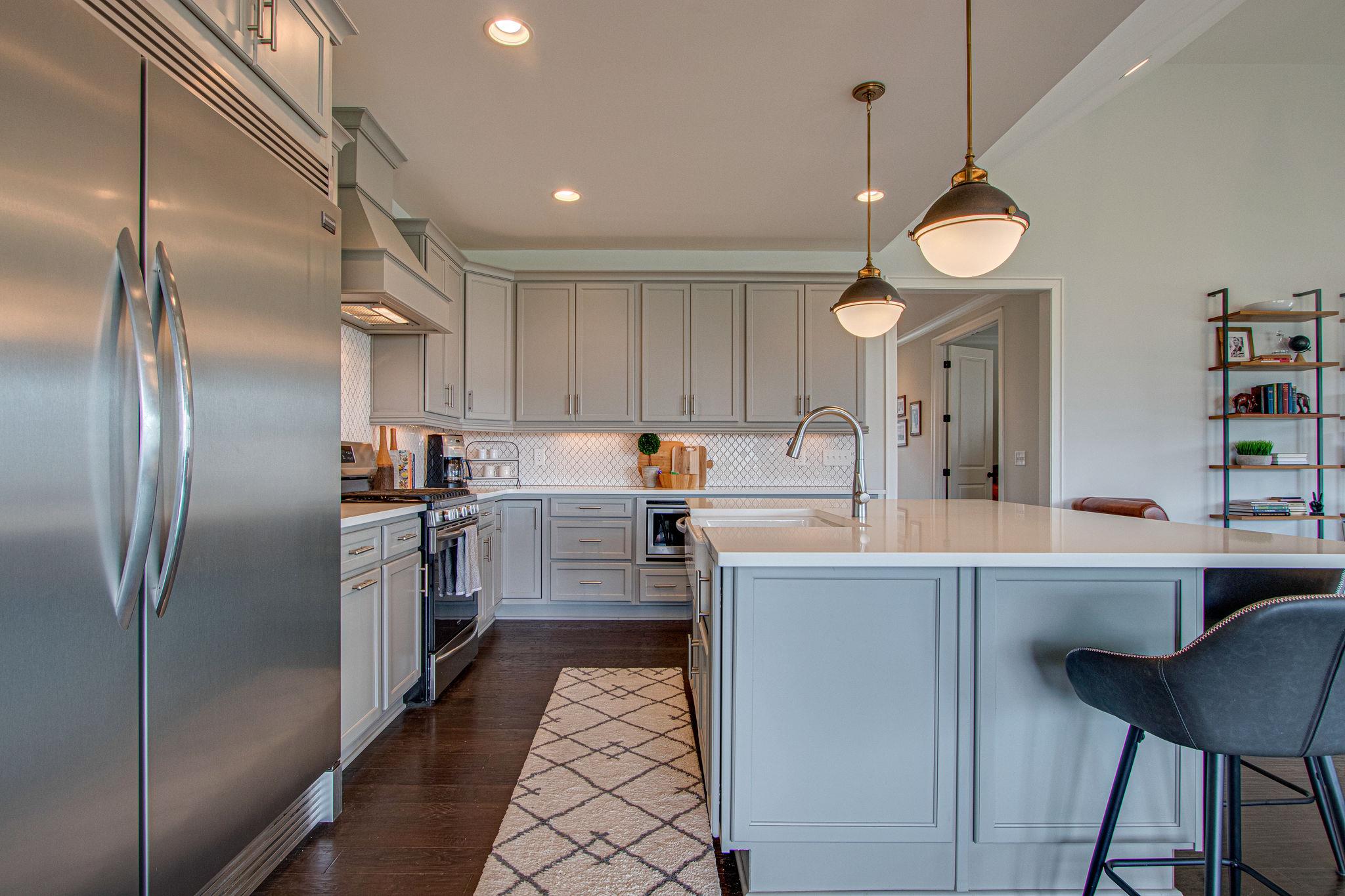 141 Vanner Road Mount Juliet, TN 37122 - Photo 7 of 29 a kitchen with granite countertop a refrigerator a stove a sink and a refrigerator