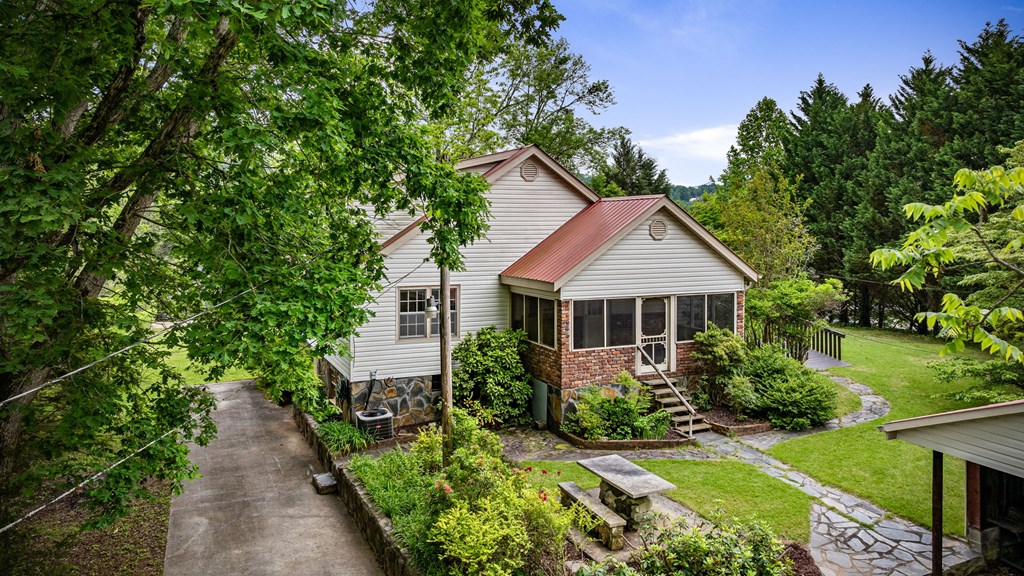 16 Hollow Springs Road Blue Ridge, GA 30513 - Photo 13 of 62 a view of house with garden and tall trees