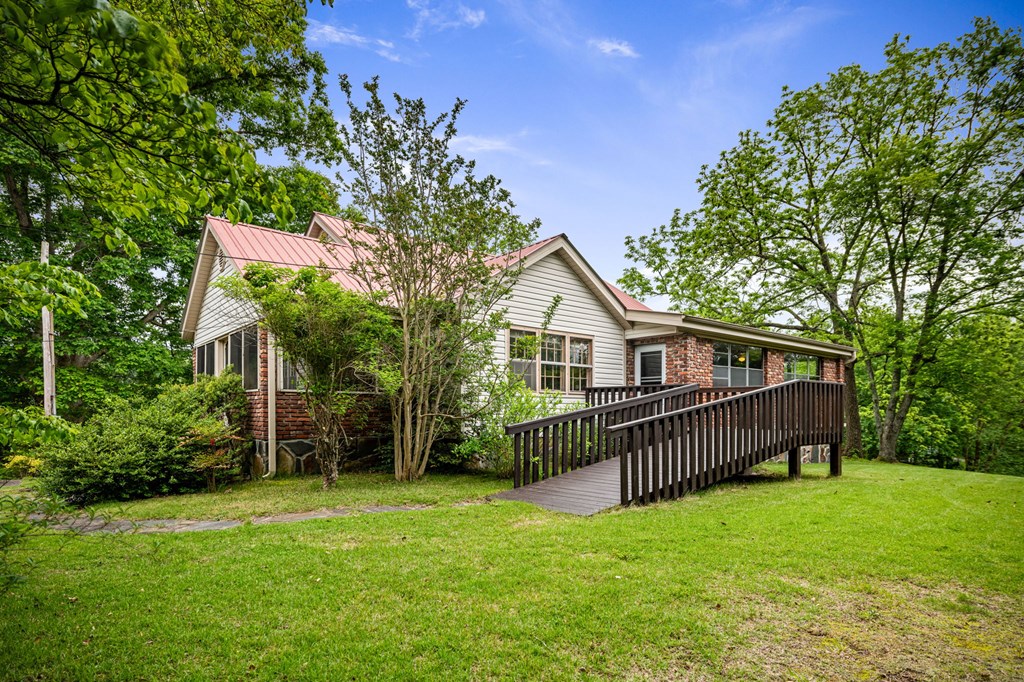 16 Hollow Springs Road Blue Ridge, GA 30513 - Photo 20 of 62 a view of a house with a yard and deck