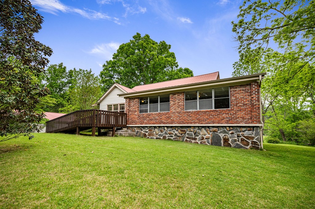 16 Hollow Springs Road Blue Ridge, GA 30513 - Photo 21 of 62 a view of a house with a yard