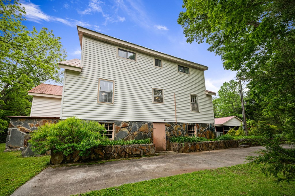 16 Hollow Springs Road Blue Ridge, GA 30513 - Photo 26 of 62 a front view of a house with a yard