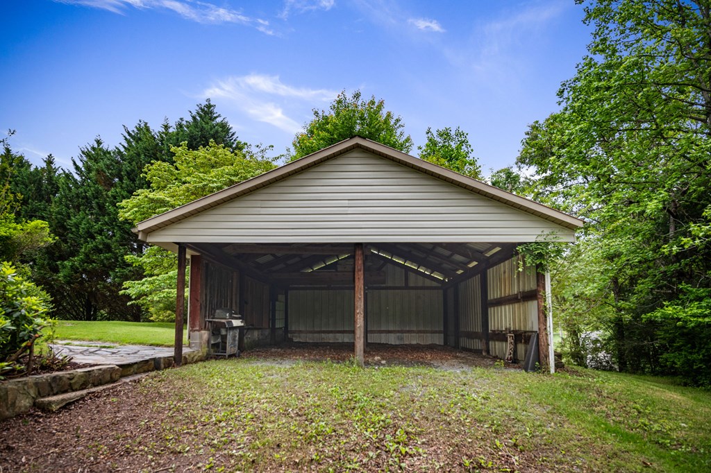 16 Hollow Springs Road Blue Ridge, GA 30513 - Photo 28 of 62 a view of a house with a yard