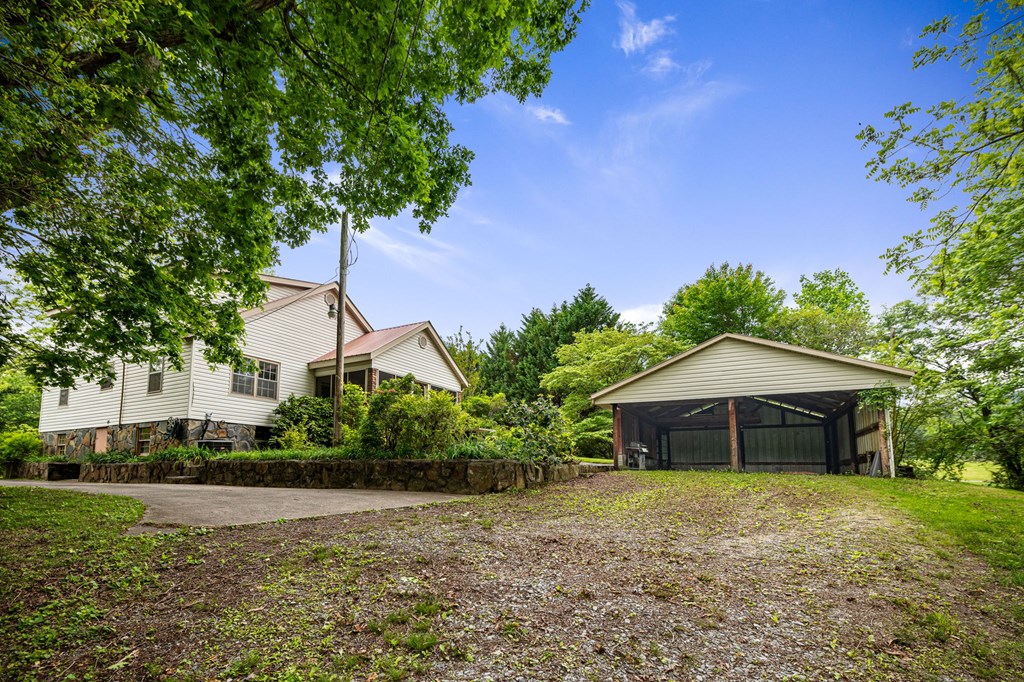 16 Hollow Springs Road Blue Ridge, GA 30513 - Photo 29 of 62 a front view of a house with garden