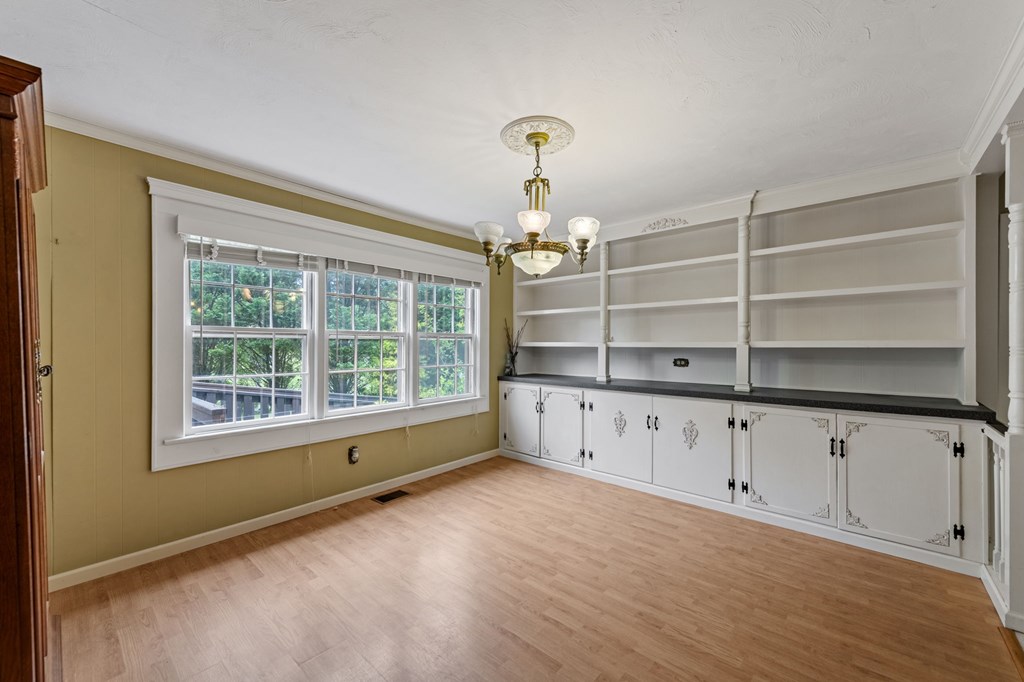 16 Hollow Springs Road Blue Ridge, GA 30513 - Photo 34 of 62 a view of an empty room with a window and wooden floor