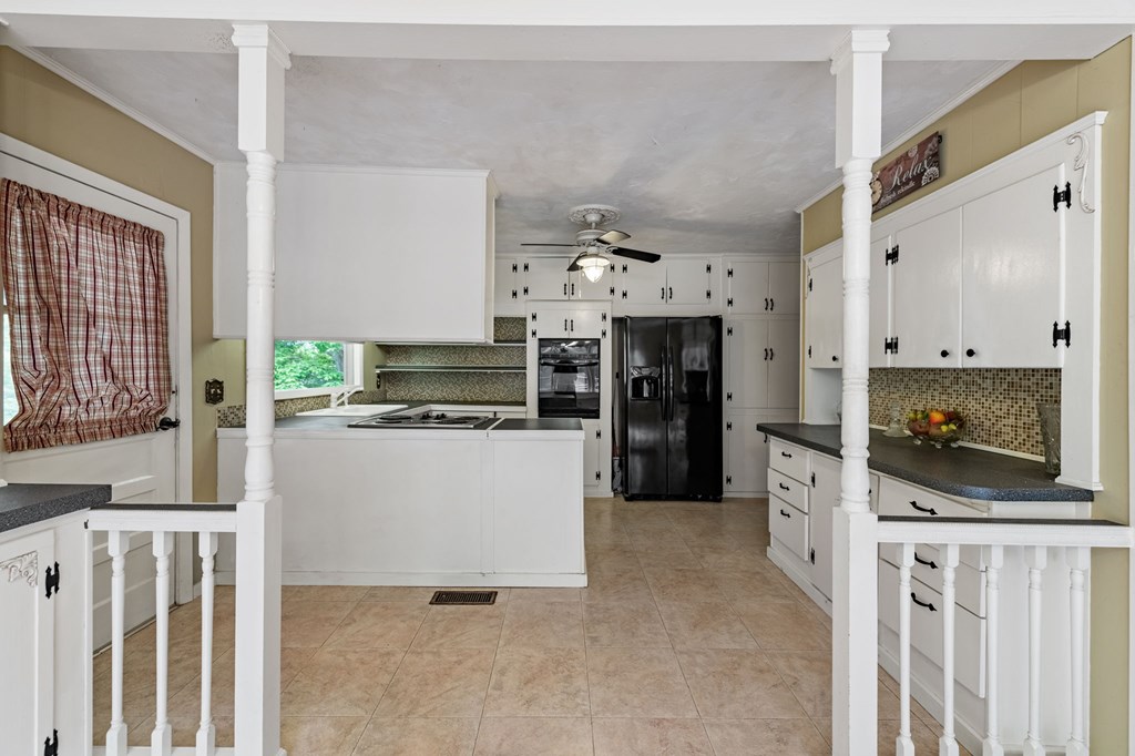 16 Hollow Springs Road Blue Ridge, GA 30513 - Photo 35 of 62 a kitchen with stainless steel appliances a stove top oven and a refrigerator